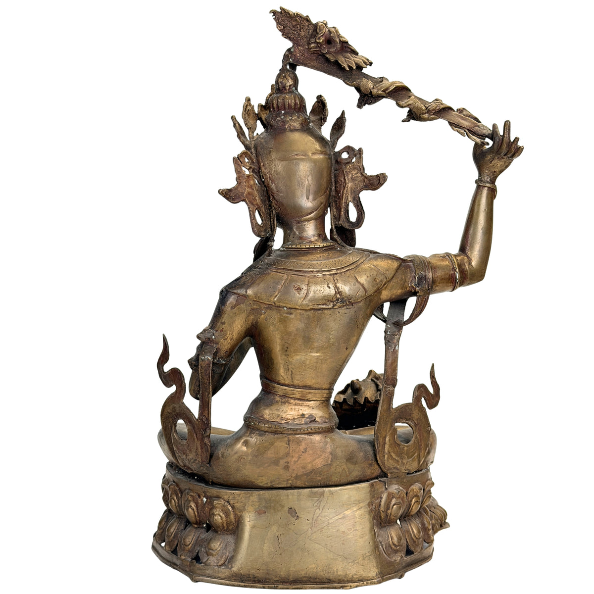 Detail van het donkere oude patina en goudkleurige oppervlakteresten op de Nepalese brons