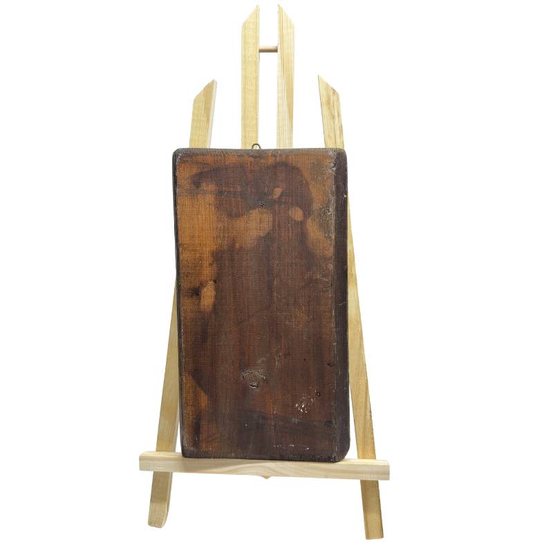 Achterkant van het handbewerkte houten icoonpaneel met sporen van ouderdom en houtwormgaatjes ter bevestiging van authenticiteit.