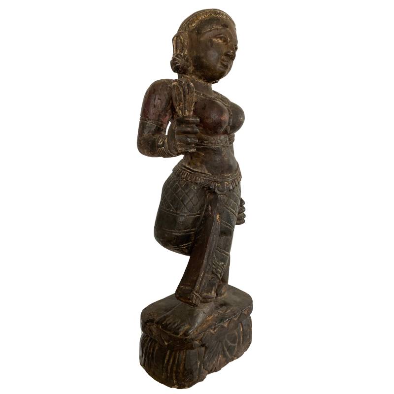 Wood grain and aged surface detail of antique Indian temple sculpture