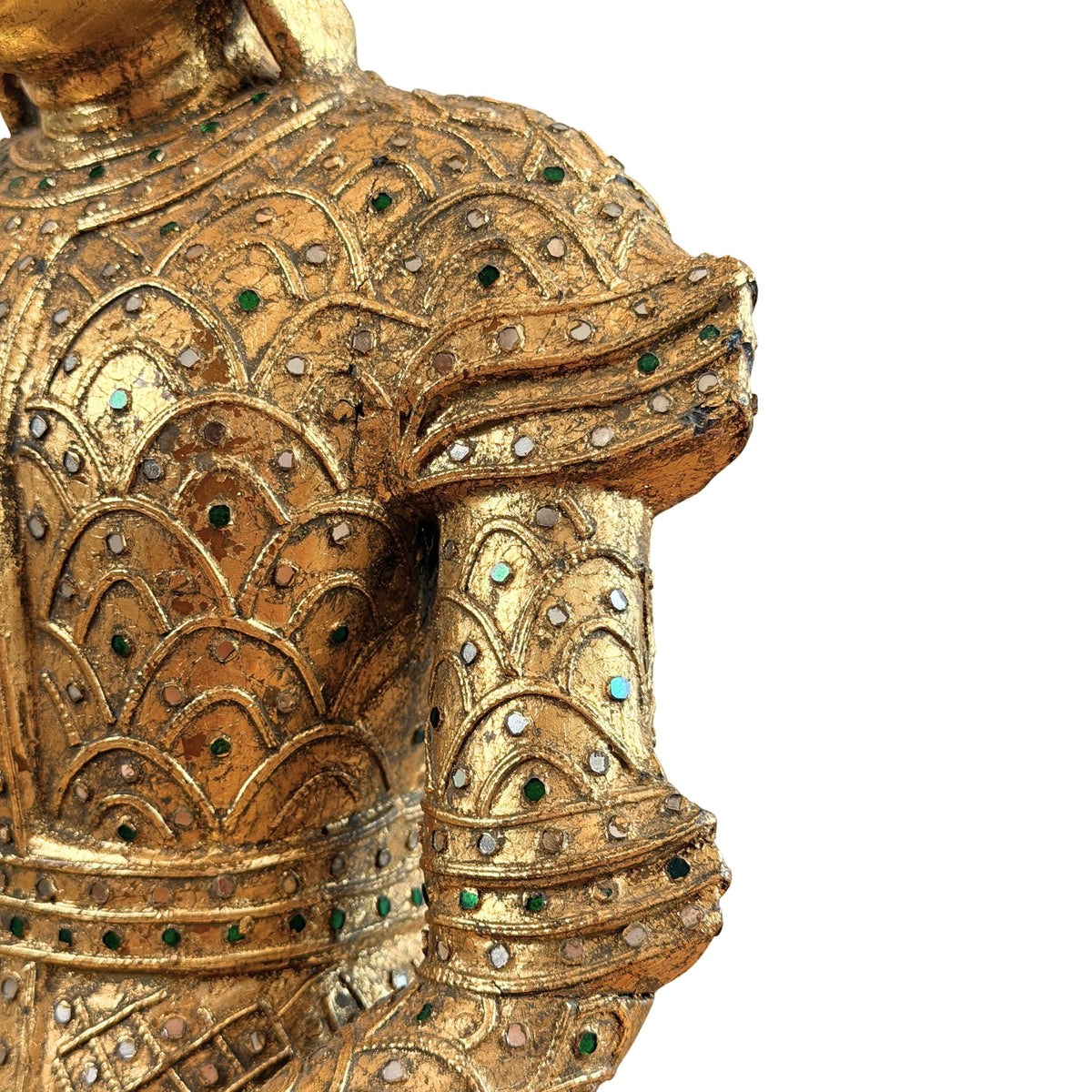 Close-up van de rugdecoratie met verguld reliëf en gekleurde glasinleg