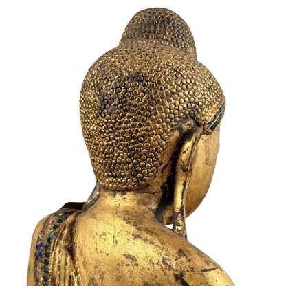 Detail van de haarcurls, ushnisha en achterzijde van het hoofd