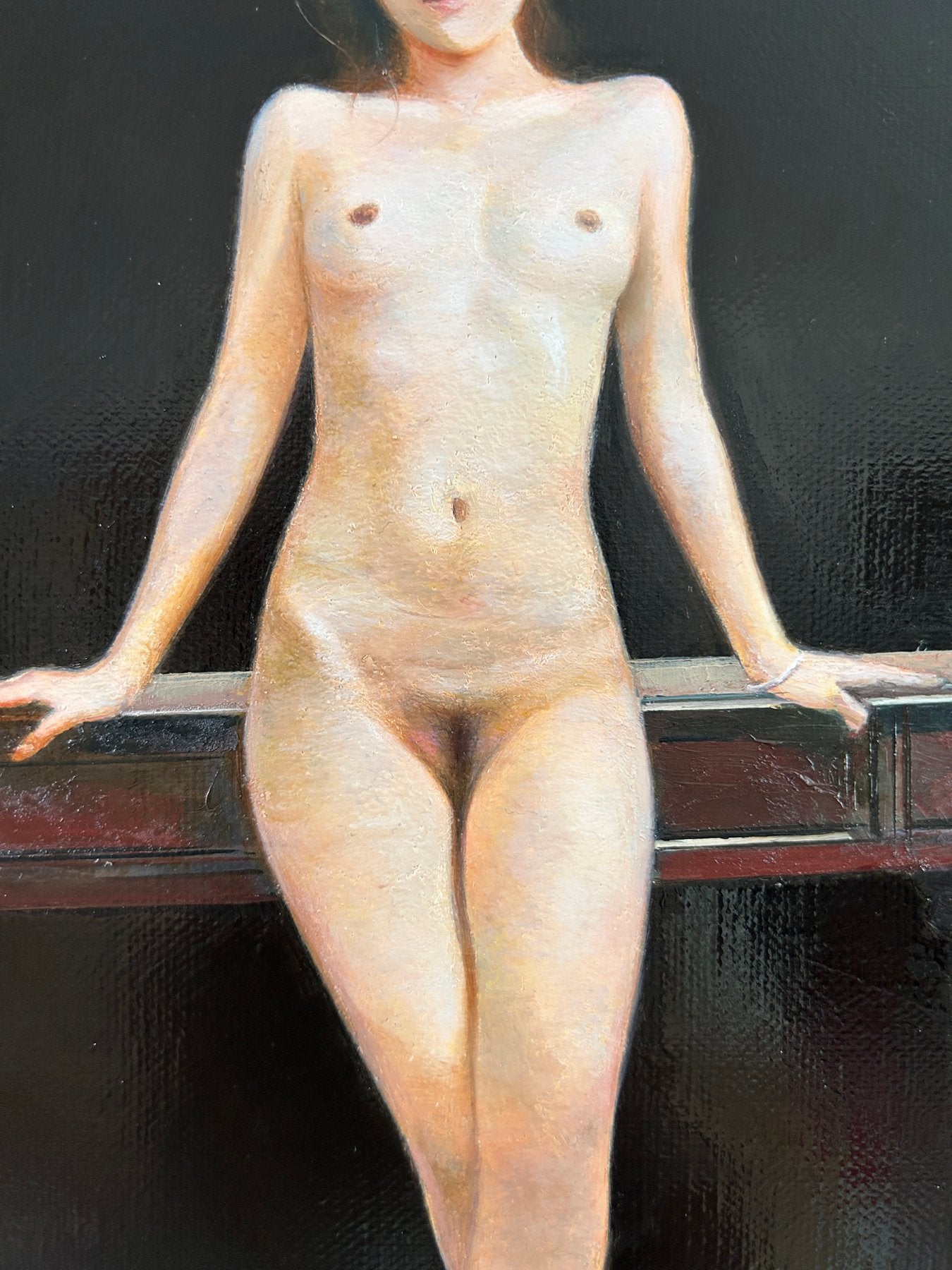 Macro-opname van de fijne verfstructuur en huidtinten in het schilderij.