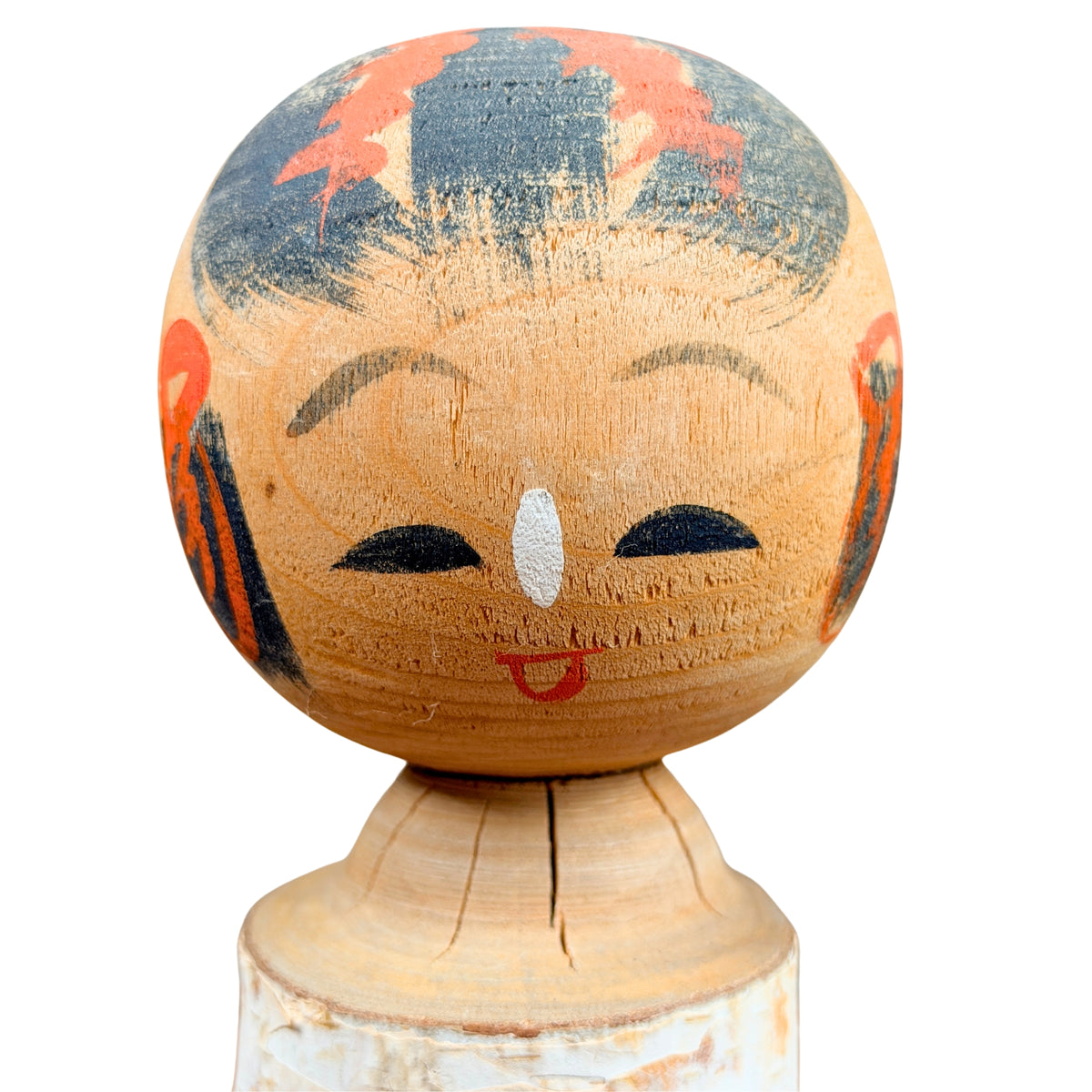Beschilderd gezicht van de kokeshi, detail