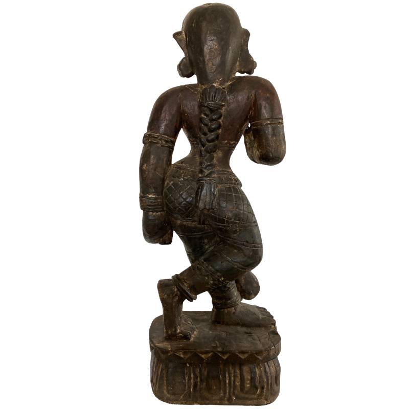 Carved detail of antique Indian wooden female temple figure