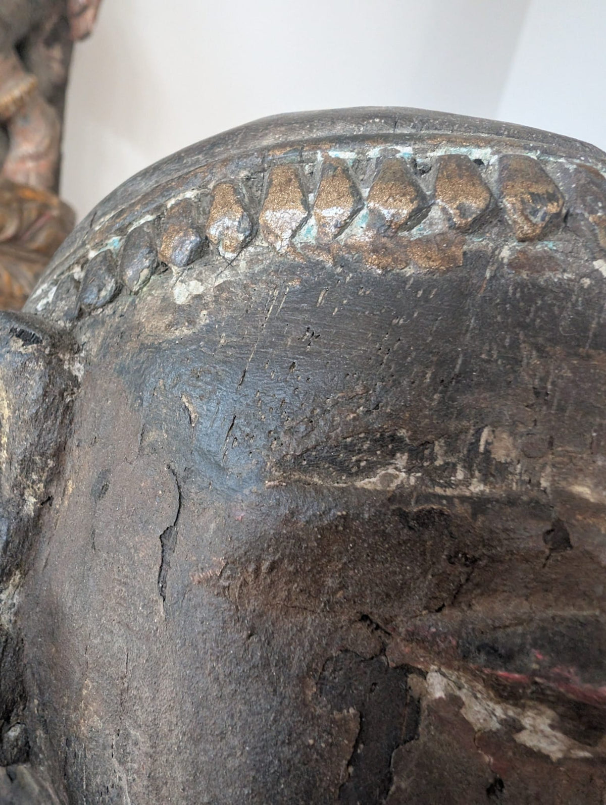 Historic patina and layered surface on antique Indian wooden figure