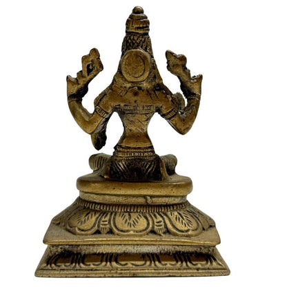 Bronzen Lakshmi beeld in lotus zitpositie op sierlijke troon
