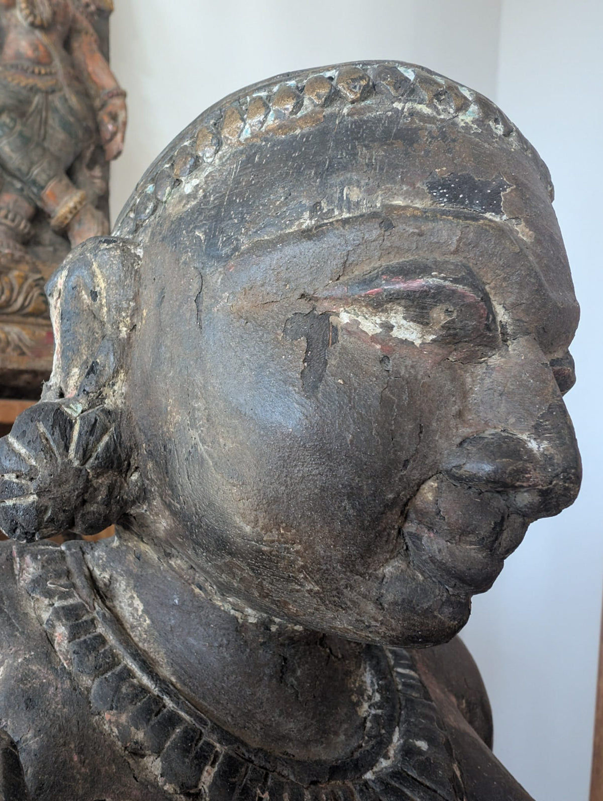 Surface wear detail on antique Indian female temple sculpture