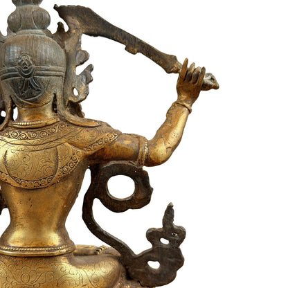 Rechter achterkant van Manjushri met opgeheven zwaardarm en schouderpatronen
