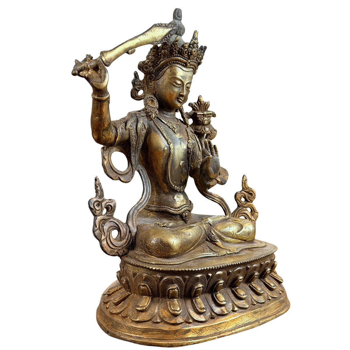 Manjushri schuin van voren, met zwaard, lotusboek en rijk versierde lotusvoet