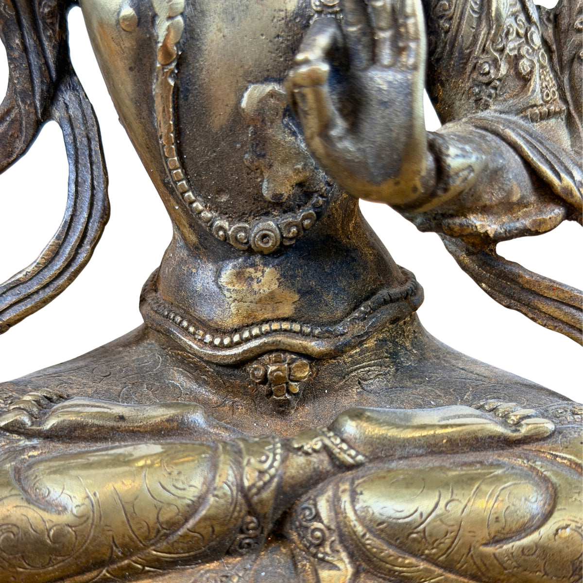 Gekruiste benen van Manjushri met ingewerkte kledingpatronen en versierde tailleband