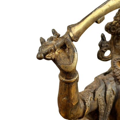 Rechterhand van Manjushri om het gevest van het wijsheidzwaard