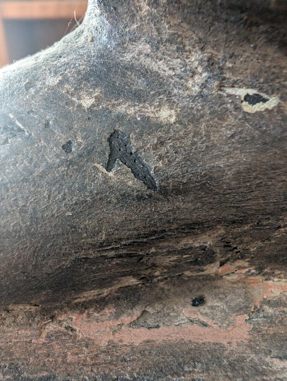 Patina and carved surface detail of antique Indian wooden female figure