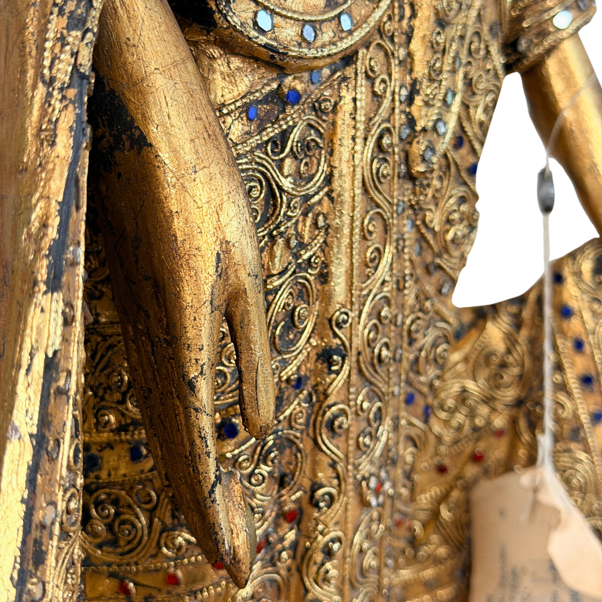 Hand en gewaad met het exportlabel, detail
