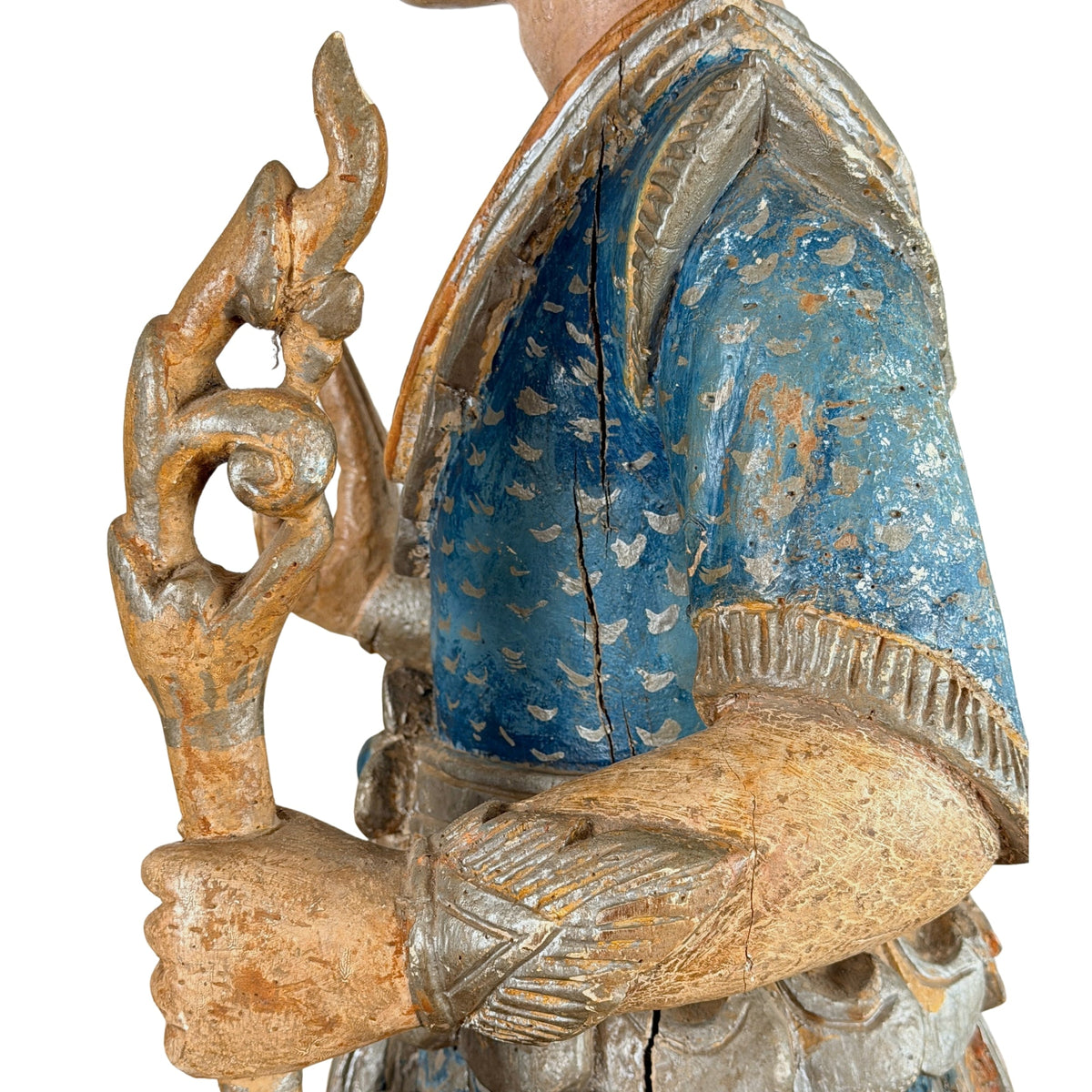 Thais teak wachterbeeld: stafbekroning naast de scheur in de blauwe schouder