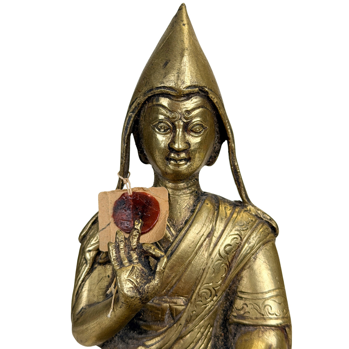 Detail van gezicht en pandita-hoed van Tibetaanse Gelug lama naast het exportzegel uit 1962
